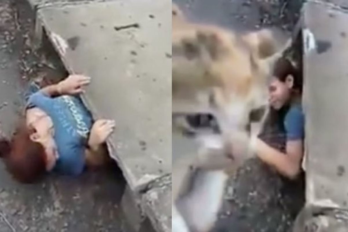 Young Woman Squeezes into a Sewer to Save Trapped Kitten